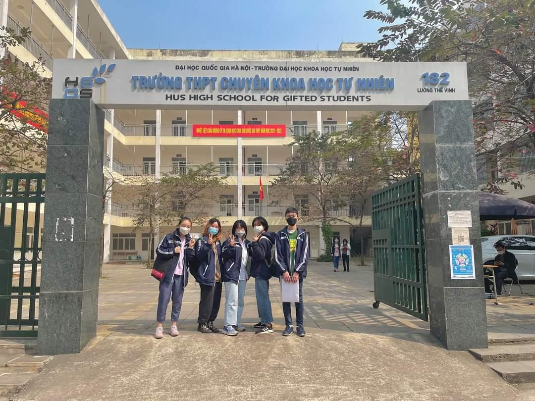 A group of people standing in front of a gated entrance</p> <p>Description automatically generated with medium confidence